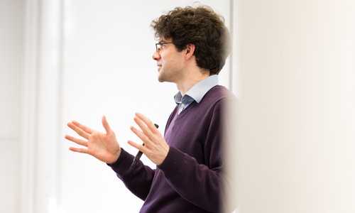 A staff member is speaking to a room